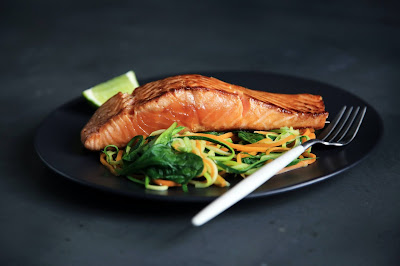 Image of a plate of cooked salmon on salad. What Is Prediabetes And Why Does It Matter?