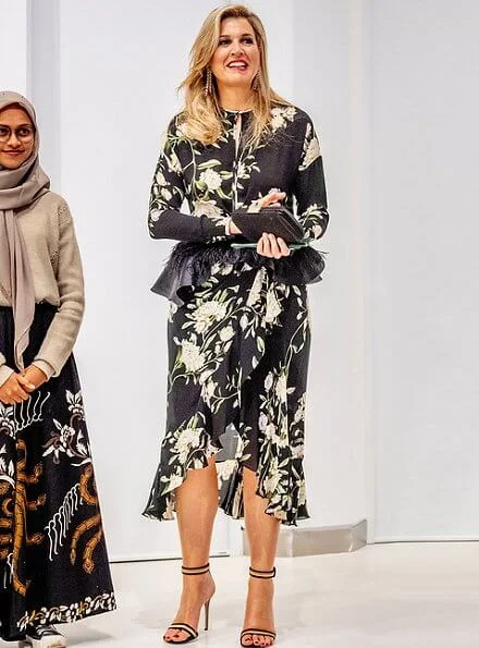 Queen Maxima wore a floral print silk dress by Johanna Ortiz, and she wore Gianvito Rossi sandals, diamond earrings