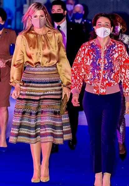 Queen Maxima wore a new ribbon skirt from Lena Hoschek. Ole Lynggaard gipsy earrings