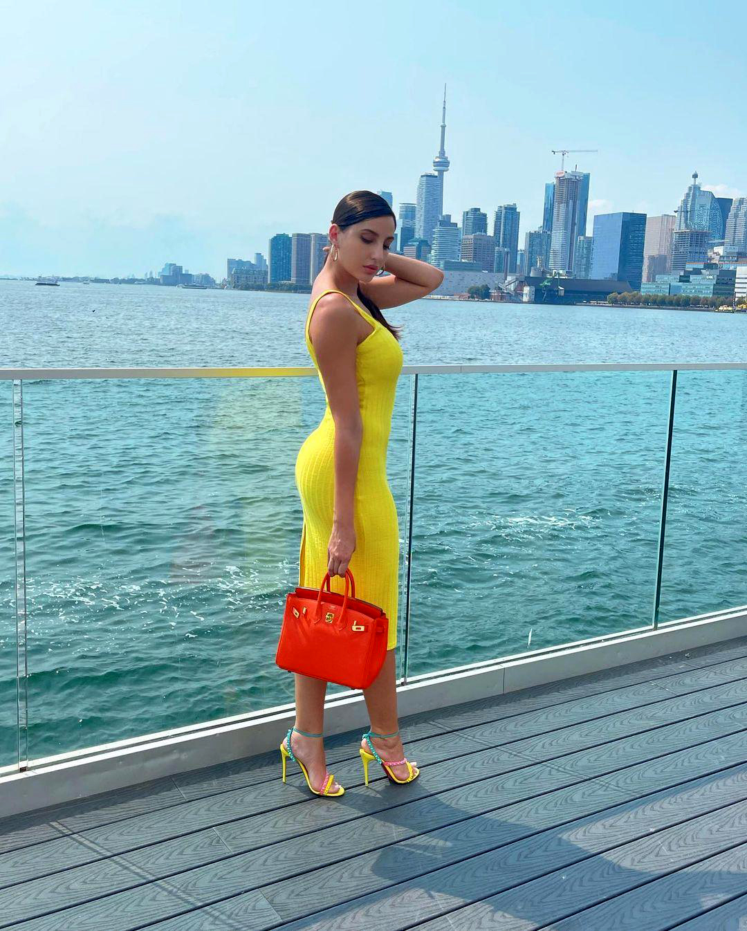 Nora Fatehi stuns in yellow dress, fans are in awe of her sizzling style