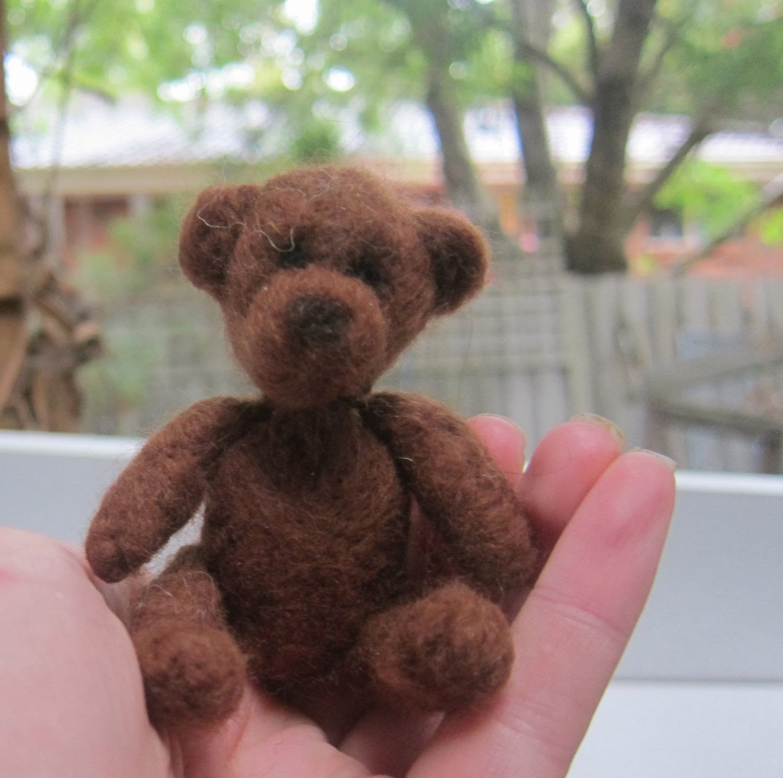 . needle felted brown bear named Milo