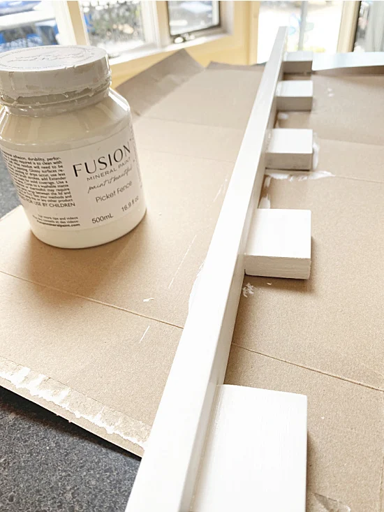 painting the shelf with fusion mineral paint
