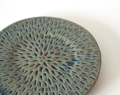 carved and glazed pottery plate