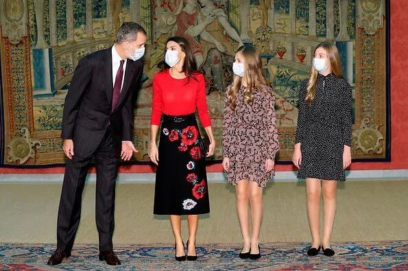 Queen Letizia wore a cashmere sweater from Hugo Boss, a poppy print knit skirt from Carolina Herrera. Infanta Sofia wore polka dot dress from Zara