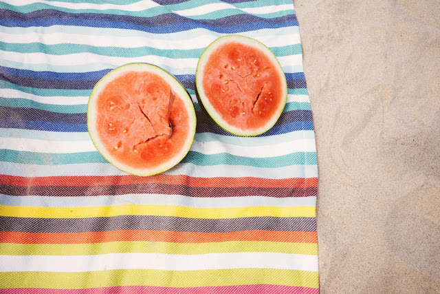 watermelon on a beach blanket