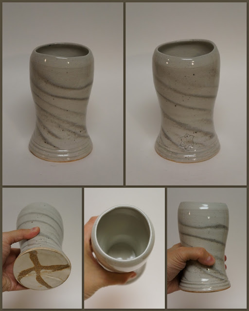 Ceramic pottery beer weisen mug cup with marbled design.