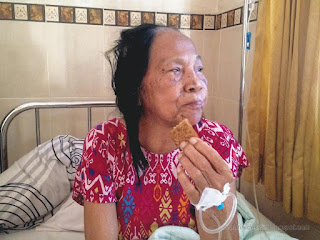 Grandmother Medical Patient Being Treated Eating Food In The Hospital Room North Bali Indonesia