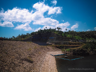 Building Landscape Of Titab Ularan Dam Wall Slope With Water Level Is Receding In The Dry Season North Bali Indonesia