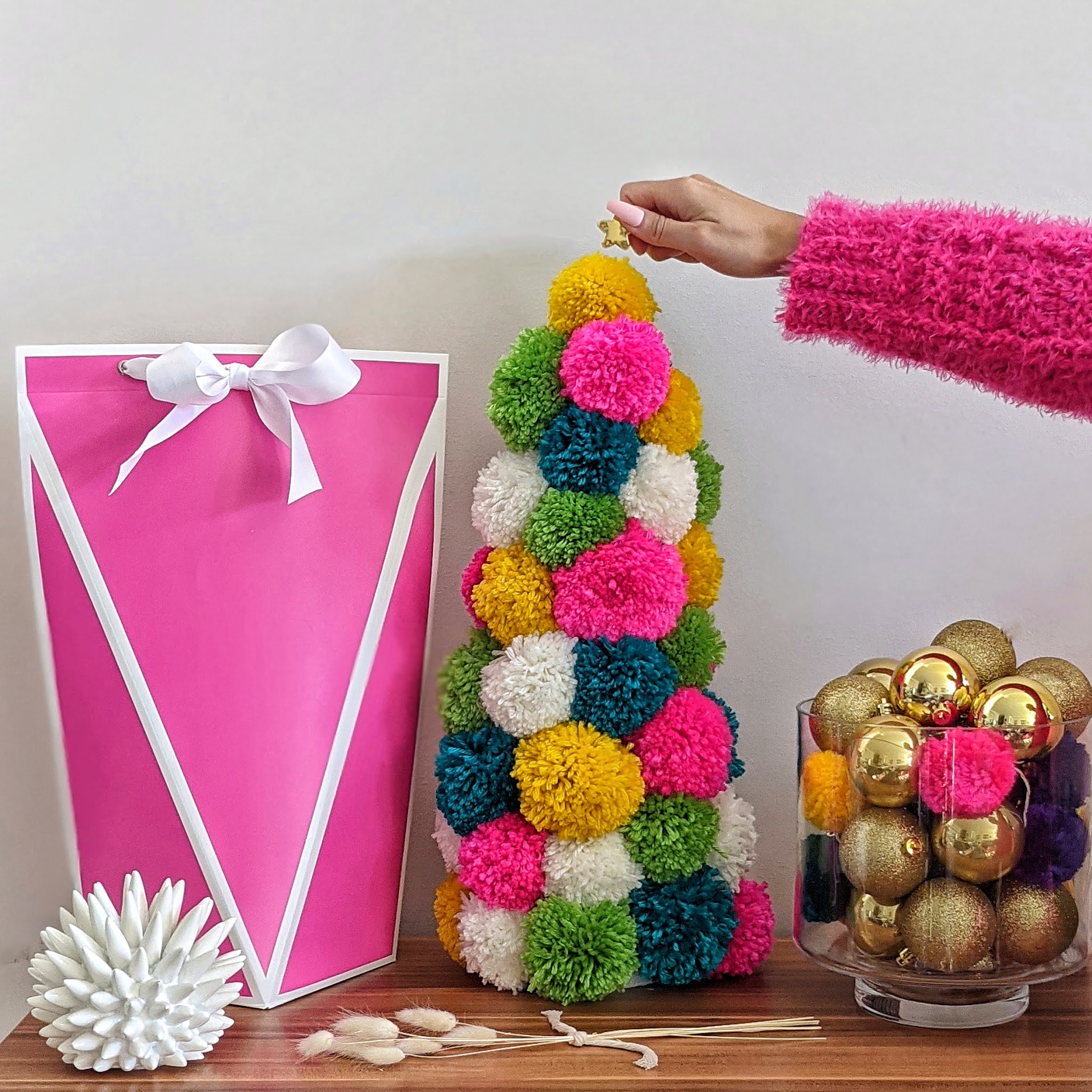 How to Make a Yarn Pom-Pom without it Falling Apart - Repeat Crafter Me