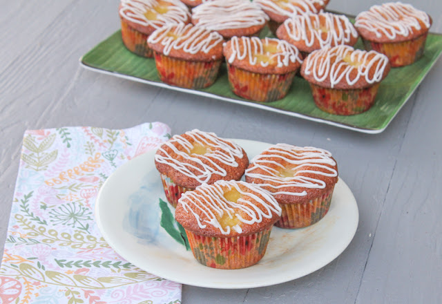 Food Lust People Love: Made with sweet cream of coconut and canned pineapple chunks, then topped with boozy glaze, these rum glazed piña colada muffins are perfect for a nippy days when you need a tropical holiday from inclement weather.