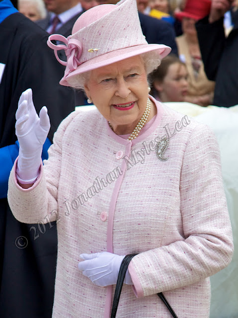 Her Majesty The Queen waving at crowds. Photo © Jonathan Myles-Lea