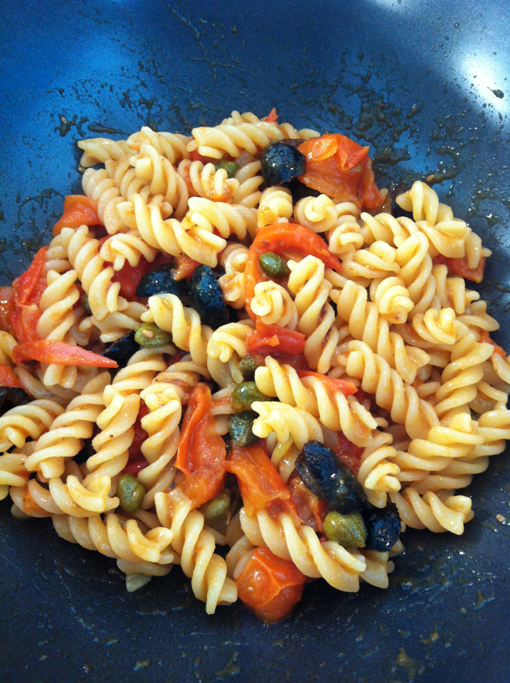 Cooking an Italian dinner abroad: Fusilli with cherry tomatoes, olives ...