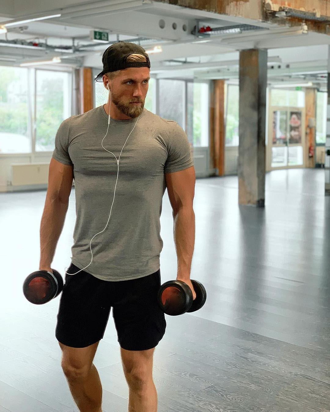 handsome-blond-bearded-norwegian-man-lifting-weights-muscle-pecs-masculine-alpha-bro