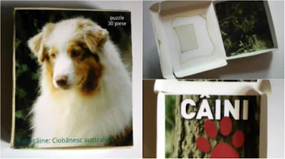 cutia pentru mini puzzle cu un caine - pe capac e imaginea capului cainelui