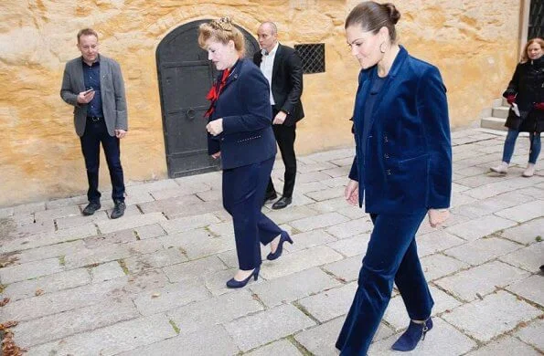 Princess Victoria wore a cord suit by Dagmar, and blue boots by af Klingberg, and pyramid earrings by Sophie by Sophie