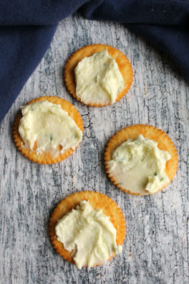This creamy, flavorful Havarti cheese ball is simple to make. It is made with very few ingredients and coated in diced bell peppers for a surprising but delicious appetizer. Havarti cheese ball mixture spread over crackers