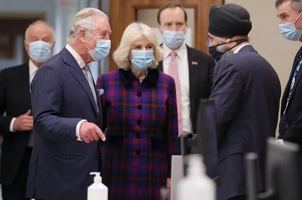 The Prince of Wales and the Duchess of Cornwall visited the Queen Elizabeth Hospital. Tartan coat dress