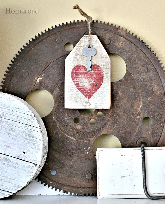 rusty gear with heart wooden tag