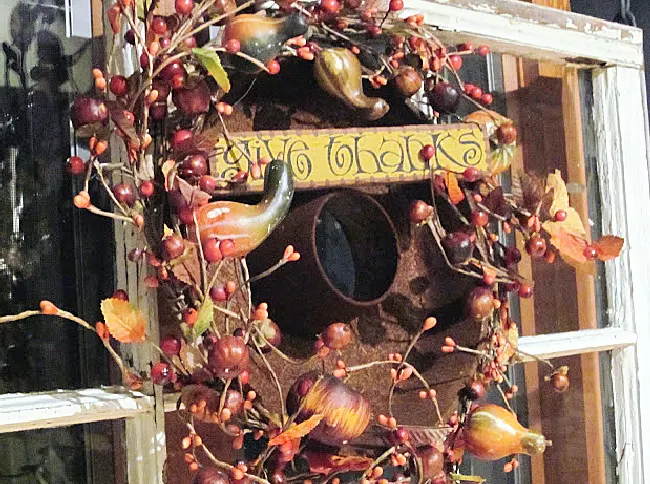 wreath with rusty pan and sign