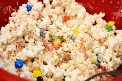 Party Popcorn is tender white popcorn that is covered in white chocolate and mixed with pretzels, M&M's and anything else you love. Life-in-the-Lofthouse.com