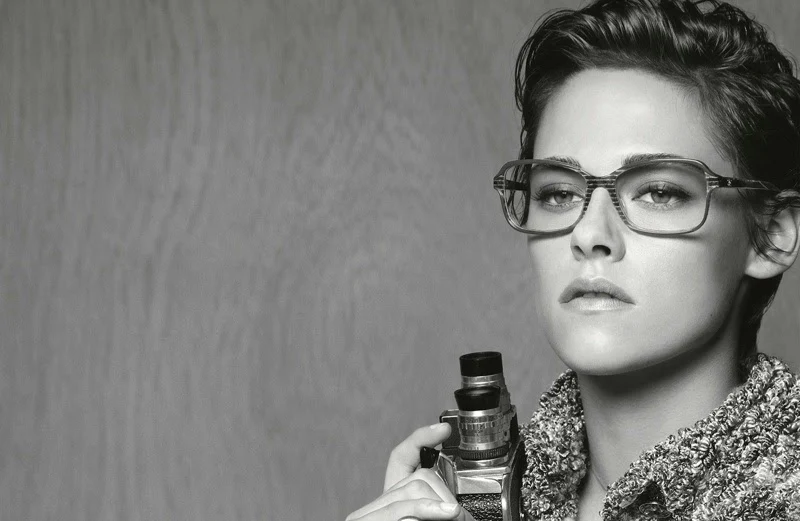 Kristen Stewart poses as a photojournalist for Chanel's Spring/Summer 2015 Eyewear Campaign