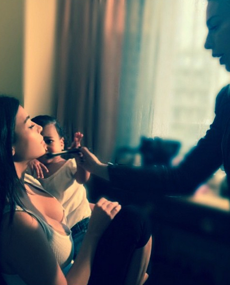 4 North West helps Kim K with her makeup...