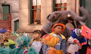 Rosita, Zoe and Grover ask the elephant why is he so angry. Sesame Street Episode 4071, Professor Super Grover's School for Superheroes