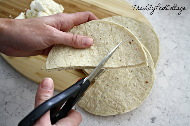 A knife on a cutting board, with Tortilla