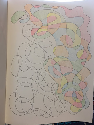 Pen-drawn squiggles partially colored in