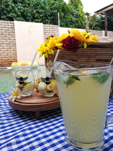 Home-made Lemonade, home-made, lemonade, lemonade recipe, picnic, pool side, drinks, summer, summer drinks, drinks recipe, food photography, drinks photography, weekend vibes, food blog, food blogger, spicy fusion kitchen, mr price home, bee, bees tumbler, kenwood, pinterest, sunflowers, flowers, lemons, mint,  roses, botswana