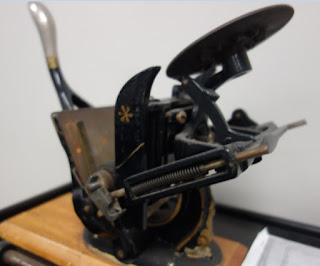 antique lever press at custom printing company in Toronto Canada