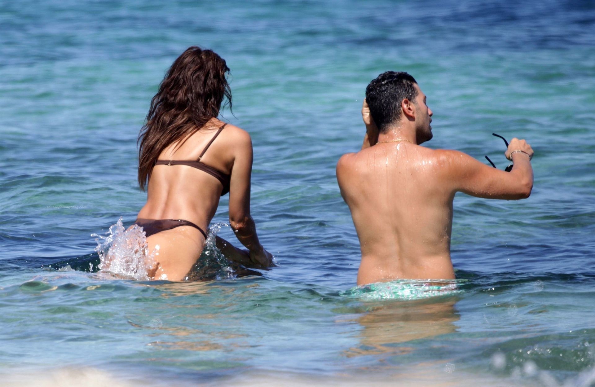 Irina Shayk showcase her ample assets in a brown bikini during Ibiza break