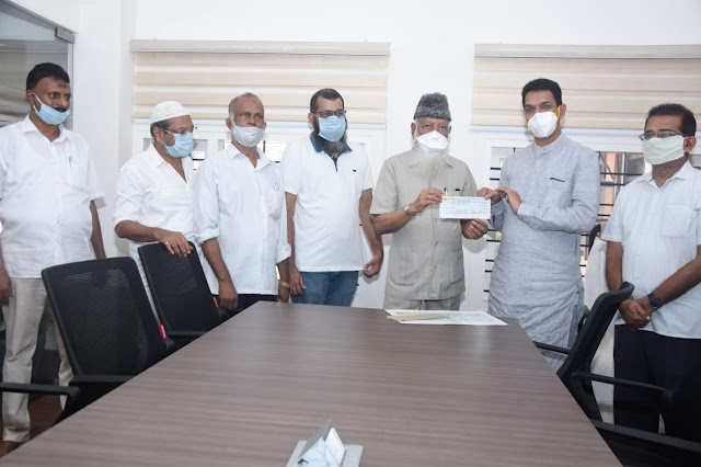 K S M Masood hands over cheque to PM CARES Fund through Nalin Kumar Kateel