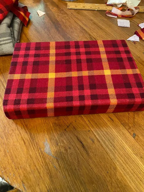 Photo of books covered with plaid flannel fabric.