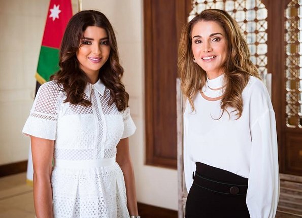 Queen Rania wore FENDI High cut-out neck satin blouse and ELLERY belted asymmetric crêpe midi skirt