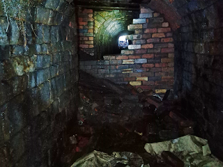 <img src="Hidden Tunnel off Alt Hill Road.jpeg" alt=" hidden tramway tunnel near park bridge in ashton u lyne" />