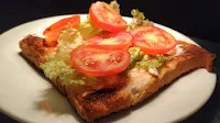 Lettuce leaves tomato slice over toasted Bread Food Recipe Dinner ideas