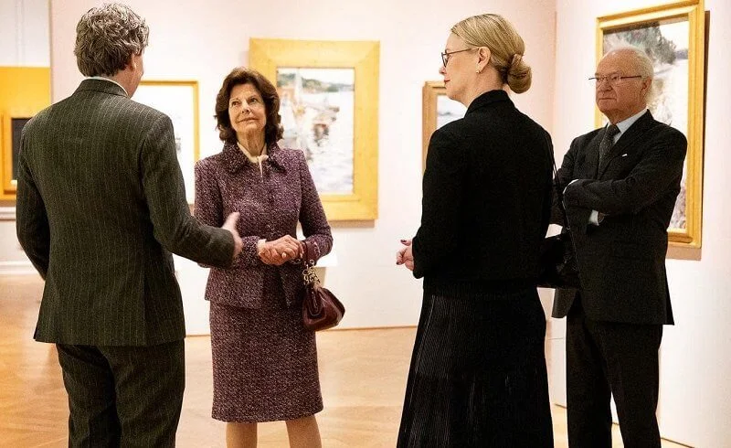 Queen Silvia wore a red-ecru maroon tweed jacket and skirt from Chanel cruise collection