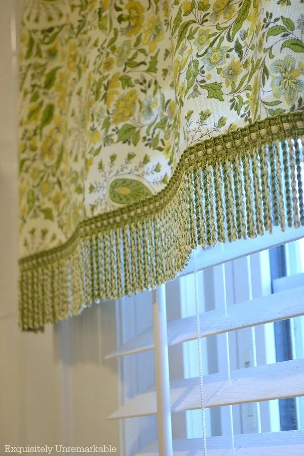 Green Paisley Valance With Fringe Trim on white trim window