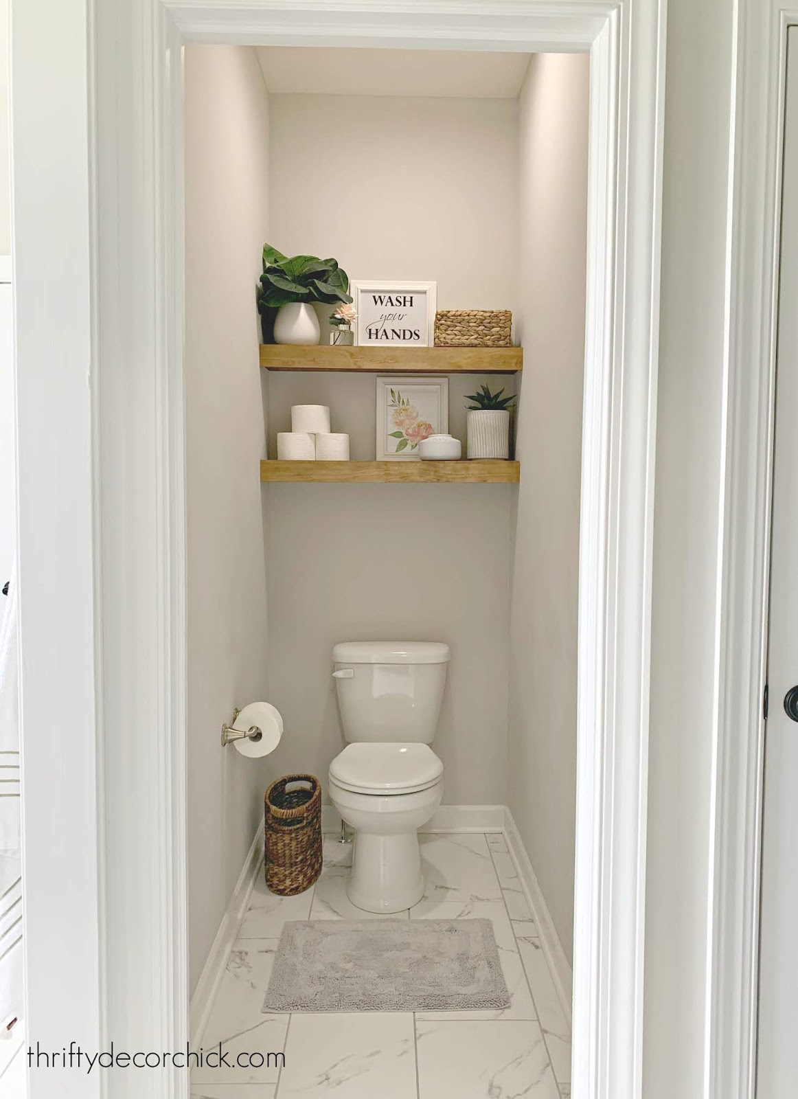 Wood shelves in small toilet space