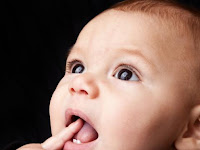 Beberapa Ciri Ketika Bayi Sedang Tumbuh Gigi