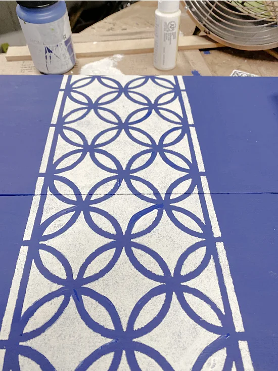 white and blue stenciled tray