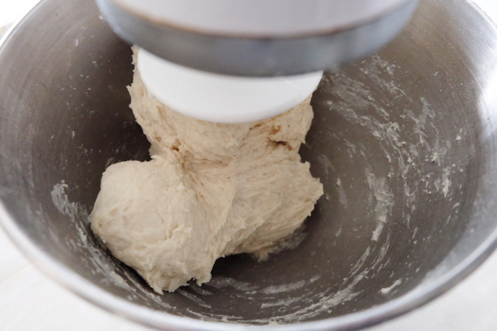 mixing ingredients in mixer to make dough