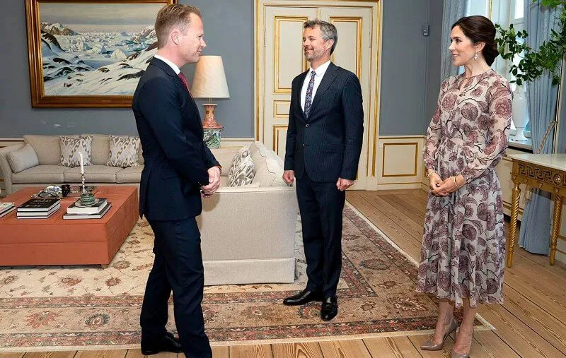 Crown Princess Mary wore a floral silk georgette dress from Burberry Prorsum, and love gold diamond bracelet from Cartier