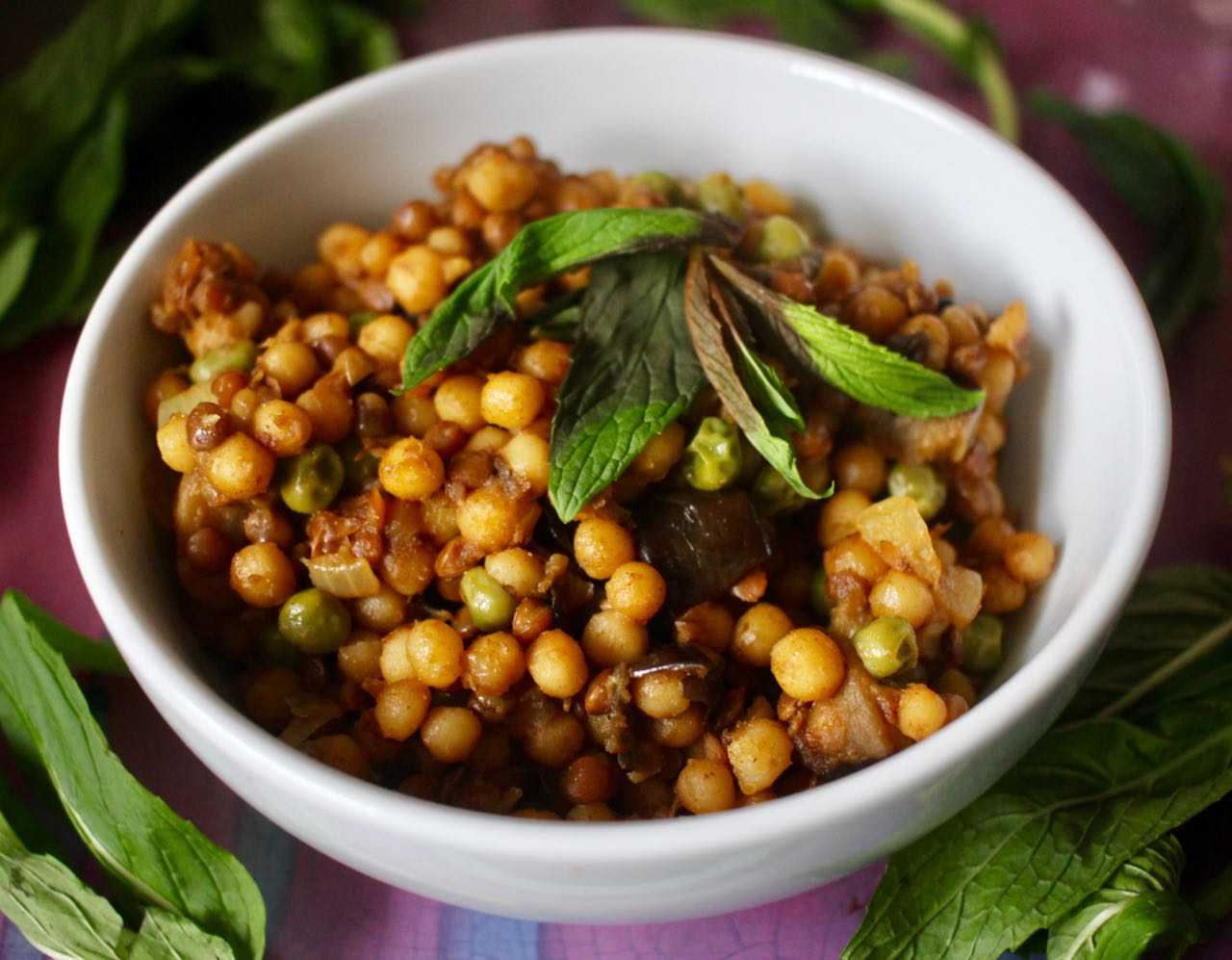 Green Gourmet Giraffe Pearl couscous pilaf with eggplant, lentils and peas