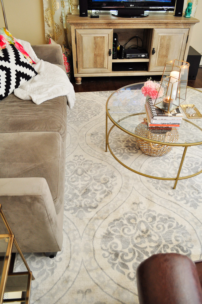 A small apartment living room gets a makeover in a few hours for under $200 with a new rug and gold decor from Better Homes and Gardens.