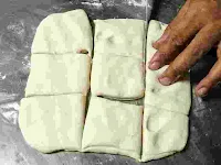 Cutted small square shape dough part for amritsari kulcha