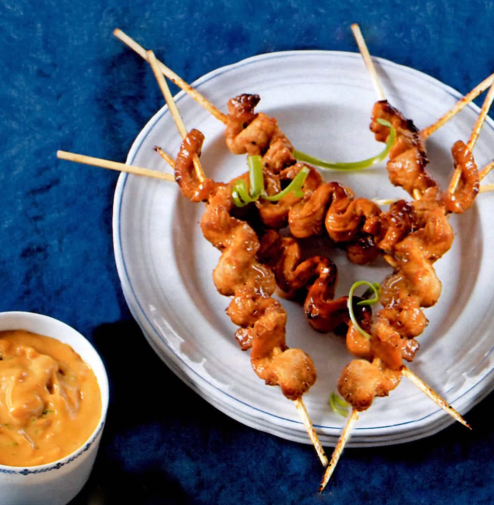 Satay Pork: Classic Indonesian-influenced dish of pork strips in a sweet chilli marinade cooked on a barbecue (grill) and served with a peanut-based satay sauce