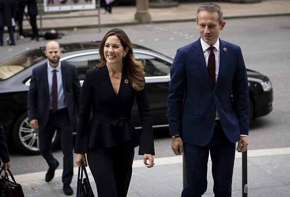 Scanlan Theodore crepe Knit wrap jacket and wide-leg trousers. Crown Princess Mary wore a crepe knit wrap jacket from Scanlan Theodore