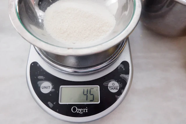 measuring powdered glue with kitchen scale